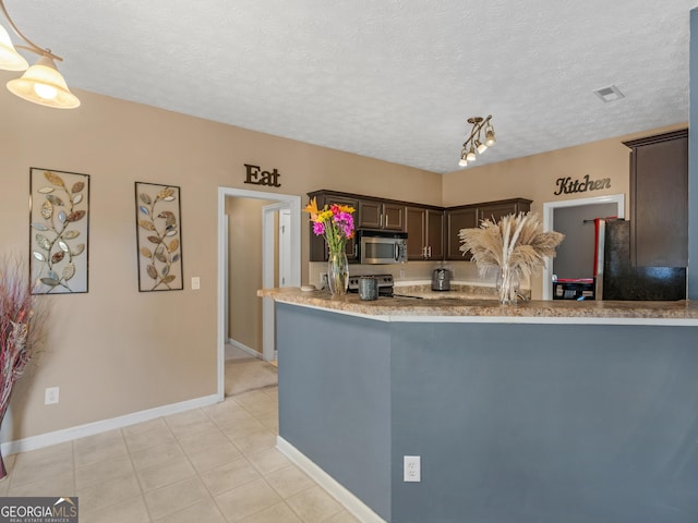 kitchen featuring dark brown cabinetry, hanging light fixtures, range with electric stovetop, kitchen peninsula, and a textured ceiling