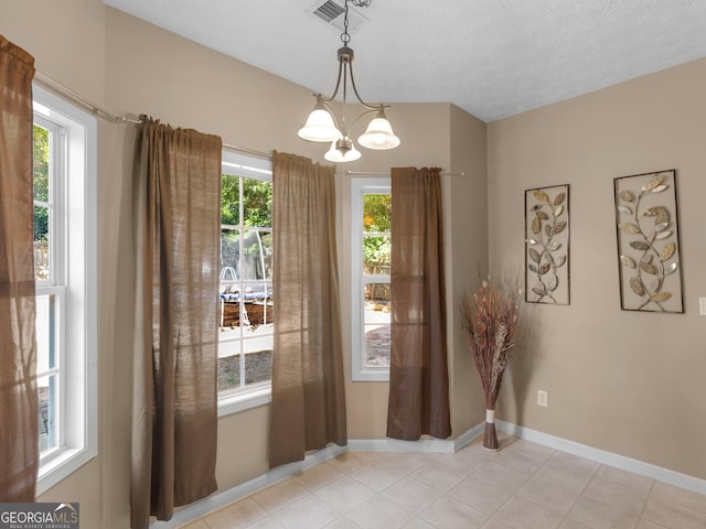 doorway with a chandelier