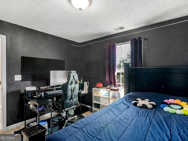 bedroom featuring a textured ceiling