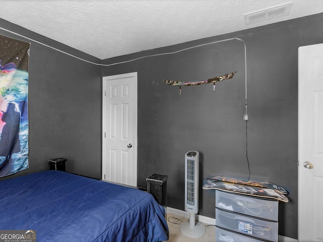 bedroom featuring a textured ceiling