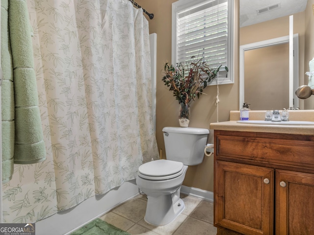 full bathroom featuring tile patterned flooring, vanity, toilet, and shower / tub combo with curtain