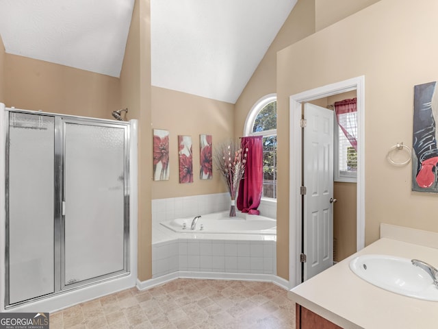 bathroom featuring vanity, separate shower and tub, and vaulted ceiling