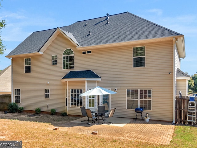 back of property with a patio area