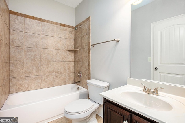 full bathroom with vanity, tiled shower / bath combo, and toilet