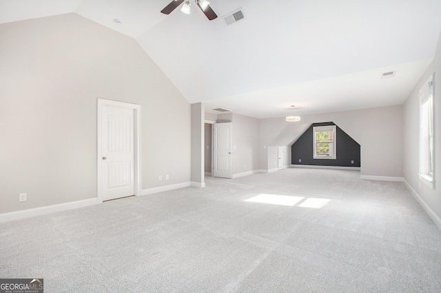 bonus room with ceiling fan, light colored carpet, and lofted ceiling