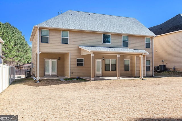 back of house with a patio area and central air condition unit