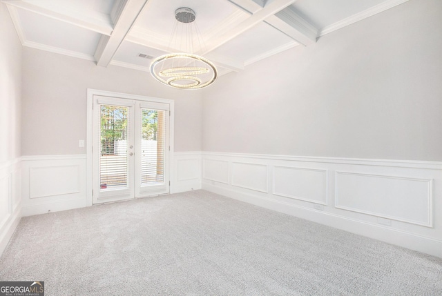 empty room with carpet, beam ceiling, french doors, and coffered ceiling