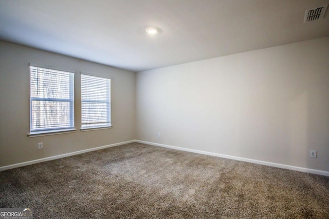 unfurnished room featuring carpet floors