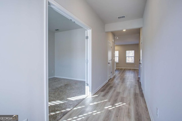 hallway featuring light wood-type flooring