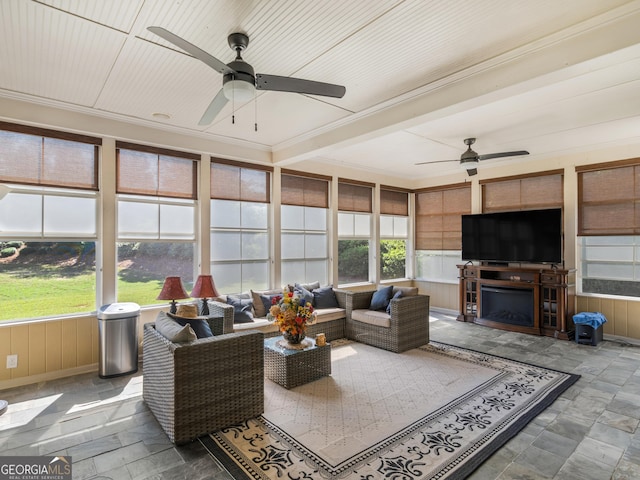 sunroom with a fireplace