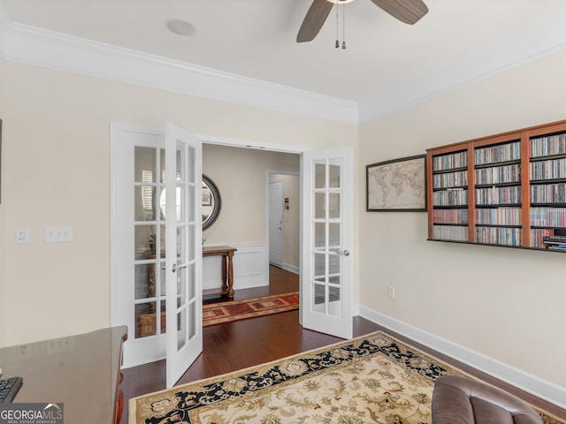 interior space featuring ceiling fan, dark hardwood / wood-style flooring, crown molding, and french doors