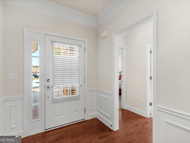 doorway to outside featuring dark wood-type flooring and ornamental molding