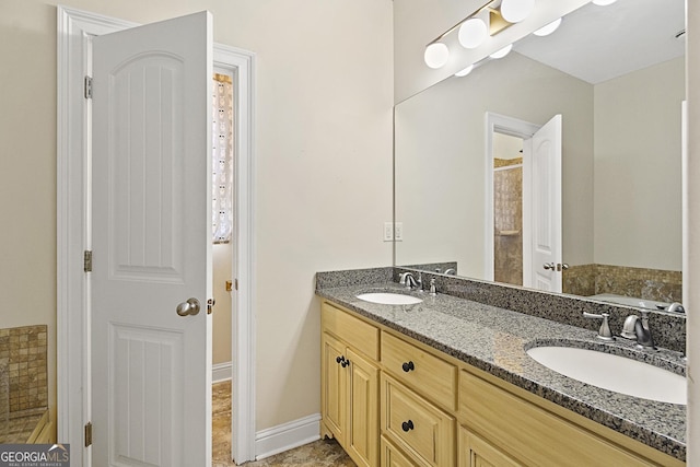 bathroom featuring a tub to relax in and vanity