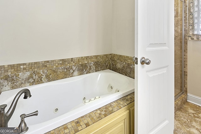 bathroom with tiled bath