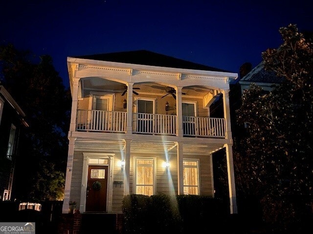 view of front of house featuring a porch, a balcony, and ceiling fan