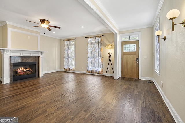 foyer entrance featuring ceiling fan, crown molding, and dark wood-type flooring