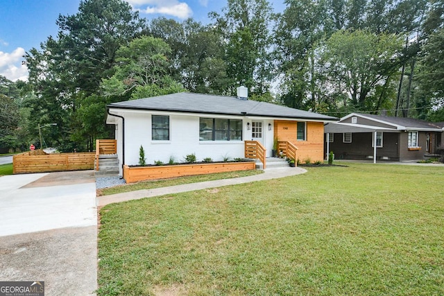 ranch-style home with a front lawn