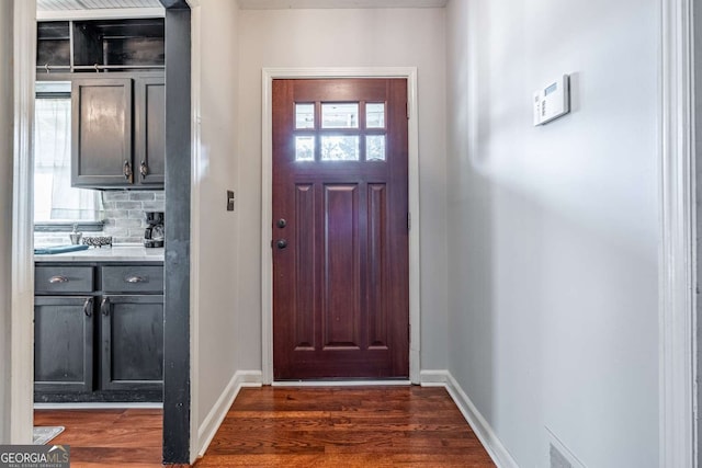 doorway to outside featuring dark hardwood / wood-style flooring