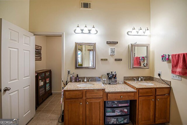 bathroom with tile patterned flooring and vanity