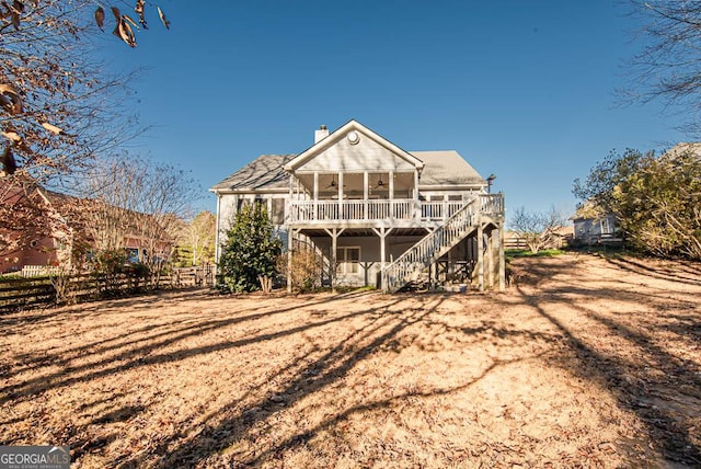 rear view of property with a sunroom