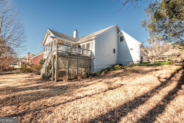 rear view of house with a wooden deck