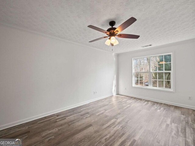 unfurnished room with hardwood / wood-style flooring, ceiling fan, and a textured ceiling