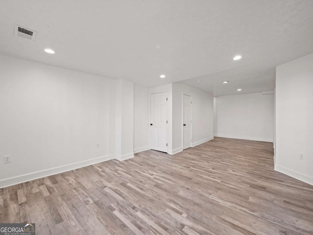 basement featuring light hardwood / wood-style flooring