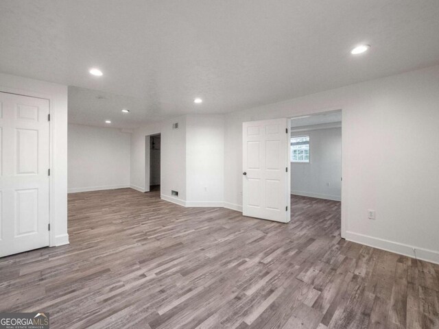 basement with light wood-type flooring