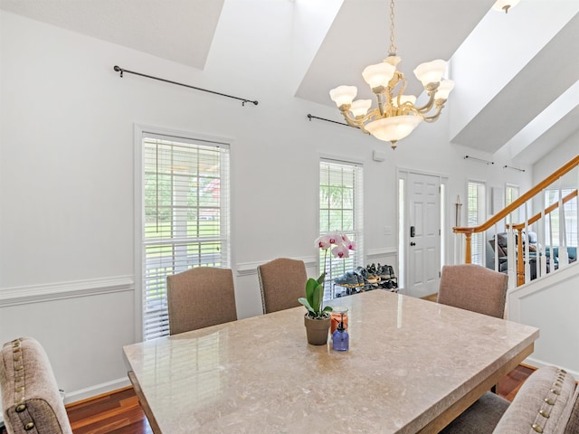 dining space featuring plenty of natural light, a chandelier, and wood-type flooring