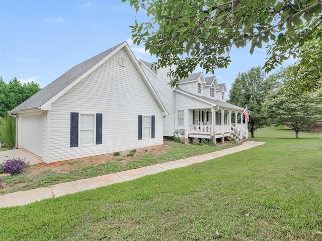 exterior space with a lawn, a porch, and a garage