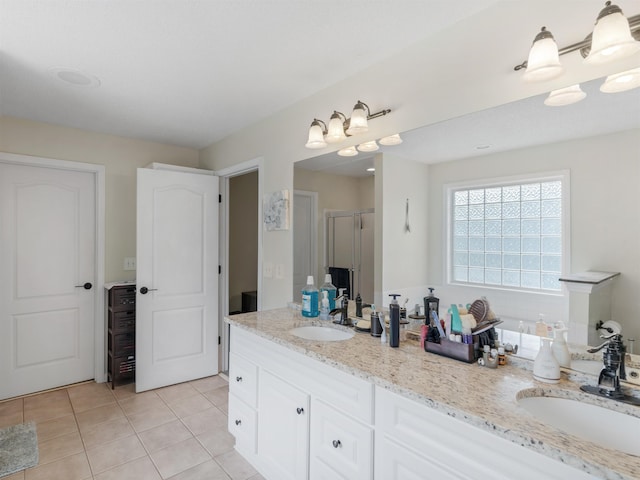 bathroom featuring tile patterned floors, vanity, and an enclosed shower