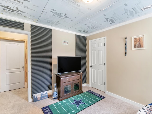 carpeted living room with crown molding