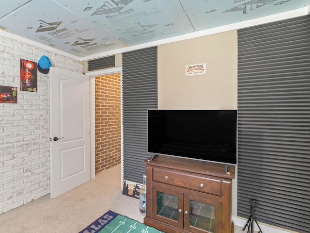 living room with light carpet and brick wall