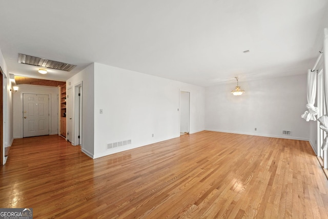 unfurnished living room featuring light hardwood / wood-style floors