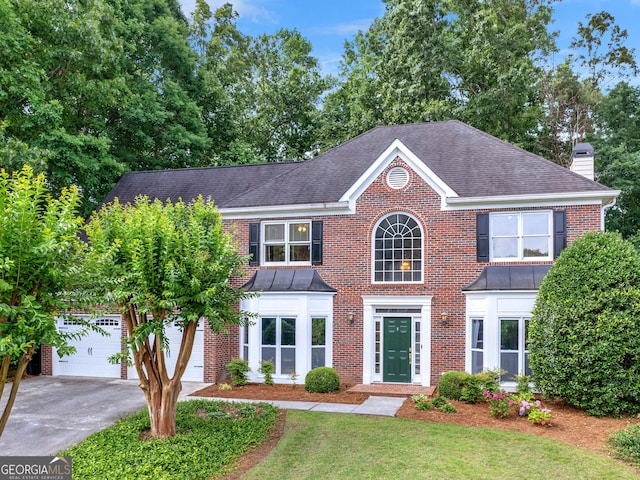 colonial home featuring a garage