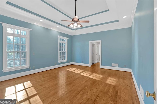 spare room featuring hardwood / wood-style flooring and ceiling fan