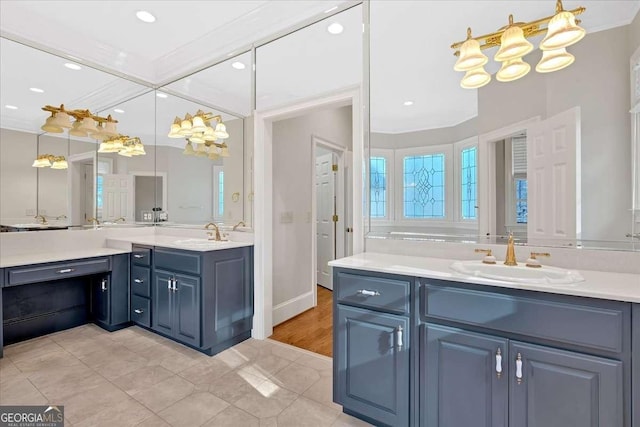 bathroom featuring vanity, tile patterned floors, and ornamental molding