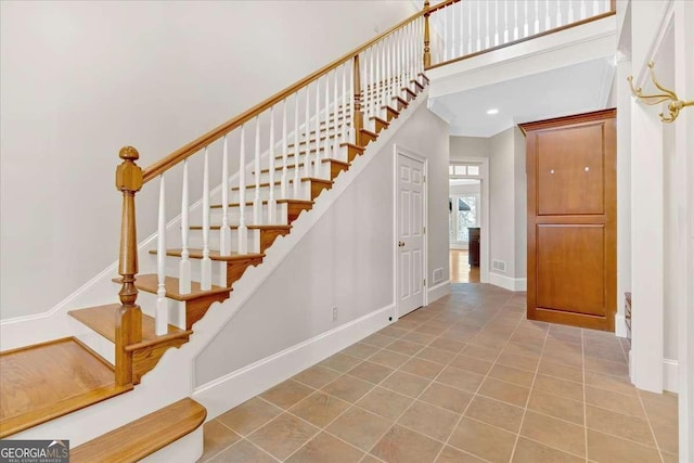 stairs with tile patterned flooring