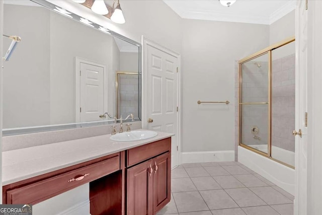 bathroom featuring tile patterned floors, vanity, ornamental molding, and bath / shower combo with glass door