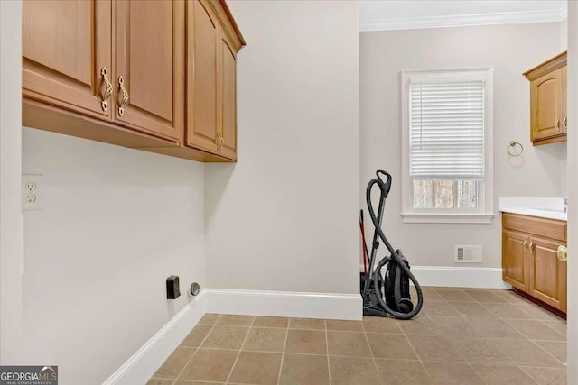 laundry room with cabinets and ornamental molding