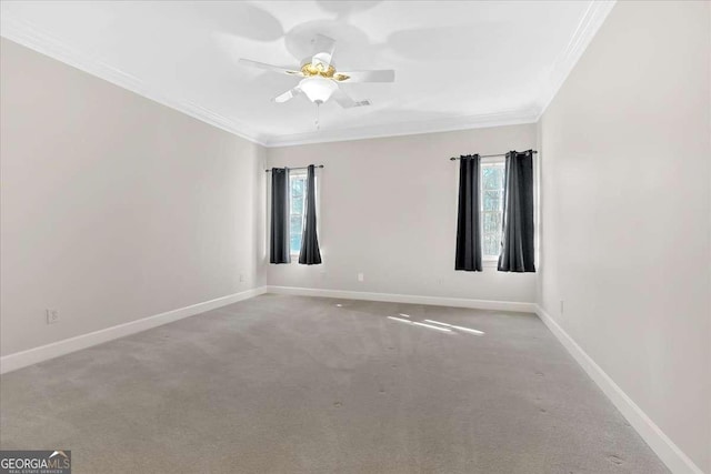 unfurnished room with light colored carpet, ceiling fan, and crown molding