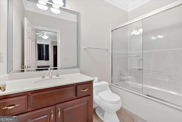 full bathroom with tile patterned floors, crown molding, bath / shower combo with glass door, ceiling fan, and toilet