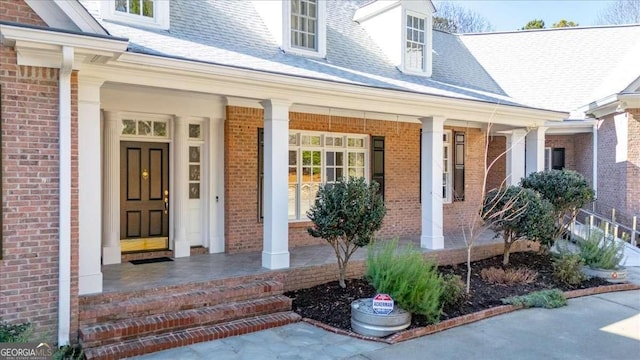 doorway to property featuring covered porch