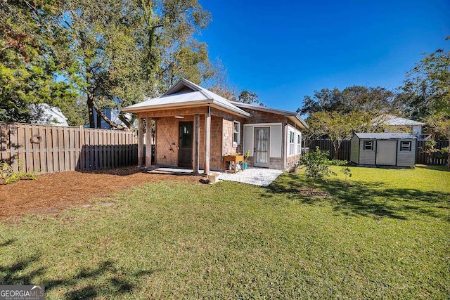 view of front facade with a shed and a front lawn