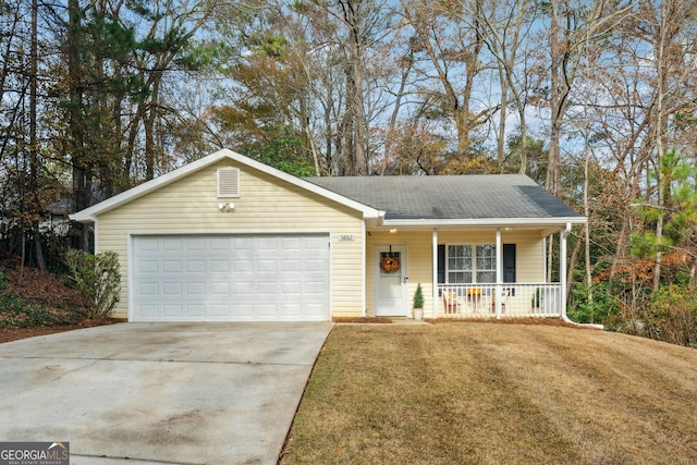 single story home featuring covered porch, a garage, and a front lawn