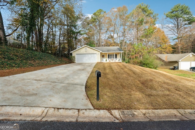 ranch-style house with a porch and a garage