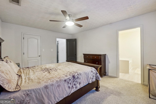 bedroom with light carpet, a textured ceiling, and ceiling fan