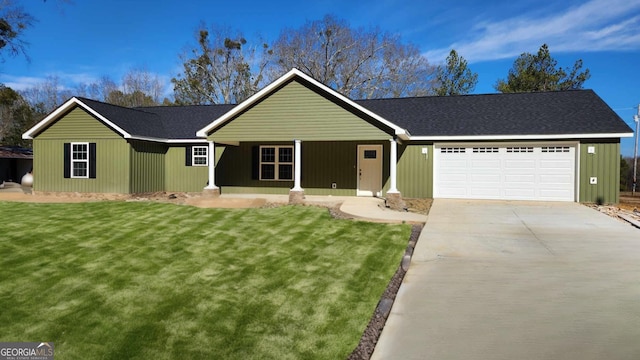 single story home featuring a garage and a front lawn