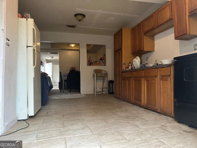 kitchen featuring white refrigerator