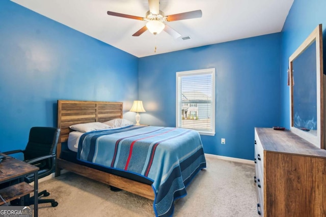 bedroom with ceiling fan and light colored carpet